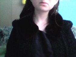 sarsenet:  lol weird selfies w/ grapefruit ft. awesome black clothes (look at that fur collar. damn)