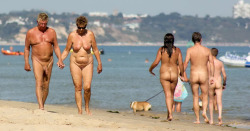 mixedgendernudity:  Mature couple walking hand in hand at the nude beach, great setting! 