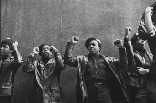 shewhoworshipscarlin:A line of Black Panther Party members are shown as they demonstrate, fists raised outside the New York City courthouse, April 11th, 1969.