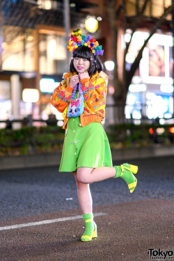 tokyo-fashion:  19-year-old Japanese fashion student Lisa on the street in Harajuku wearing a colorful fun style that features a headdress handmade out of toys, a plush bear muffler, kawaii pompom purse, and vintage fashion with neon accents. Full Look