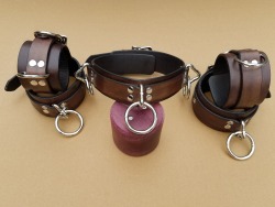 painted-belle: nefariouskinks:   dominionleathershop:   Made a complete set of the antique black ankle and wrist cuffs and collar for a very special someone.  With three dangling O-Ring on the collar and dangling O-Ring on the ankles as well (so they