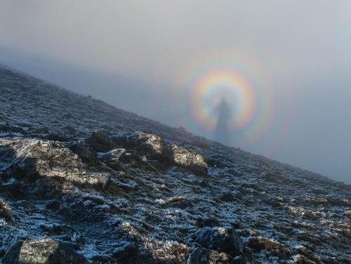 fectusing:Examples of a Brocken Spectre, a phenomenon where a person’s giant shadow appears magnified onto clouds miles away. The shadow from the sun behind the person creates a halo, giving it an angelic appearance. This mostly occurs on any misty
