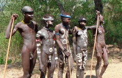thenakedspiritualist:  The Surma tribe of Ethiopia paint the nude bodies of males who compete in a combat ritual. The men fight each other with “donga”, a type of stick, and the tribe chooses the winner. The champion is awarded a mate from the tribe.
