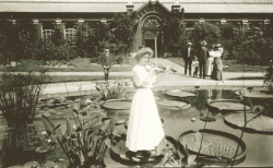 yesterdaysprint:    A young girl plays a violin while standing on lily pad in front of Linnean House at Shaw’s Garden (Missouri Botanical Garden), St Louis, ca. 1910  