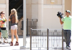 Not sure who she is but they were videotaping down on the strip. She has some big titties and no bra.