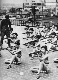 Japanese girls receiving shooting training during school in the 1930s.