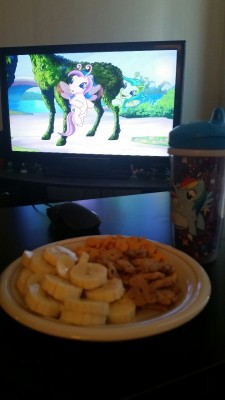 First sippy cup with some banana slices, gold fish and teddy grahms! My Little Pony in the bachground! Finally feeling little!
