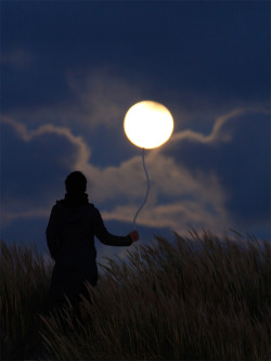 lulz-time:  Moon Games, French photographer Laurent Lavender has subjects play with a rising moon, effectively transforming it into a balloon, a painting, and even a scoop of ice cream.  // Selected by Sunil  
