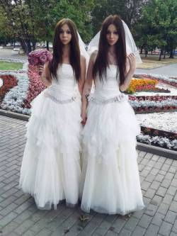 lgbtqblogs:   Two brides have become two of the most kickass women in the world by marrying to protest against homophobia in Russia. Alina Davis, a 23-year-old trans woman, and Allison Brooks, her 19-year-old partner, donned matching white floor-length