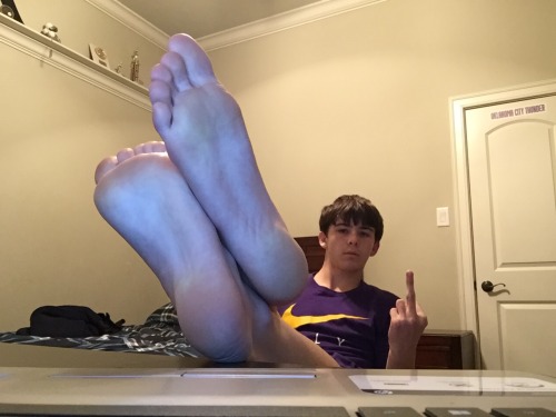 Cute young teen boy feet