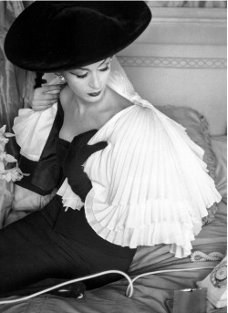 vampdreaminginhollywood:  Dovima for Vogue, April 1956. Pleated capelet and black dress by Jacques Fath, Ph Henry Clarke 