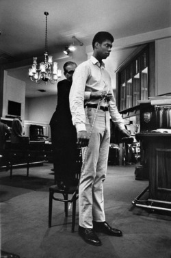 Bill Ray - Future NBA Hall of Famer and UCLA Bruins star Lew Alcindor (Kareem Abdul-Jabbar) being fitted for trousers with a 51-inch inseam, Beverly Hills, 1971.
