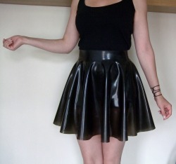 plastickatlatex:Translucent smokey black skater skirt! Made for Miss Plastica, this skirt has an awesome translucent look in daylight &lt;3 Want one? Request a custom item on etsy- Plastic kat’s paws