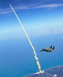 thedemon-hauntedworld:  Birds Eye View of Shuttle Launch. Lt. Col. Gabriel Green and Capt. Zachary Bartoe patrol the airspace in an F-15E Strike Eagle as the Space Shuttle Atlantis launches May 14, 2010, at Kennedy Space Center, Fla. Photo credit: U.S.