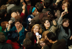 Women use compact mirrors in packed crowd to catch sight of the queen in London, June 1966.Photograph by James P. Blair, National Geographic