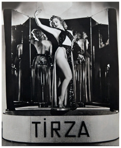 Tirza      (aka. Leona Duval)Vintage promo photo from an appearance at  the 1939-edition of the New York World’s Fair, where she would debut her “new” Wine Bath shower.. Sponsored by the Chicago Wine Company, the 񙇈 device featured 2 illuminated