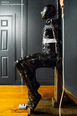 tapedandtortured:Bound with black pallet wrap. Like a human trash bag, only trashier, that one.
