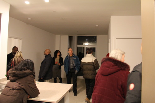 Options workers and sales team marvel at the two bedroom suite.