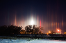 nubbsgalore:  a light pillar is an atmospheric phenomenon created by the reflection of light — be it from the sun near the horizon, the moon (or even a distant planet), or artificial city lights — off millions of flat hexagonal plate shaped ice crystals,