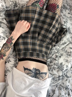 pleatedminiskirts:  spannie:Oi but how nice is my new skirt though I do love those beautiful tatoos… as for that skirt…