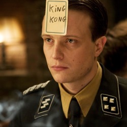 beautilation:  This scene in Inglourious Basterds, this particular part, was so brilliantly written. The characters are playing a game where you sit in a circle and write a famous person’s name on a card, flip it over, pass the card to the person