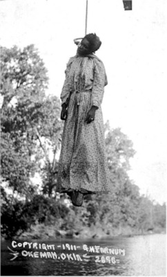 carlzies:  accras:  rudegyalchina:  choice36c:    Laura Nelson was lynched on May 23, 1911 In Okemah, Okluskee, Oklahoma. Her fifteen year old son was also lynched at the same time The photograph of Nelson was drawn from a postcard. Authorities accused