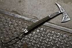 gunsknivesgear:  RMJTactical Tomahawk. There is something exceptionally brutal about an axe.  A sword implies grace and skill.  An axe evokes images of severed limbs and split skulls. RMJ’s design is full-tang, unlike most tomahawks on the market. 