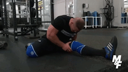 John Cena stretching out legs