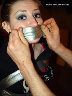 gagged4life:  Note how tight the tape is stretched as it’s put on, making a clear indention between her lips after the gag is finished. That’s good gagging technique right there.