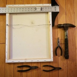 Getting stuff hang-ready. I really like the bent long-nose pliers for turning in the screw-eyes.  The hammer is probably a 100 years old, the handle is a metal pipe wrapped in electrical tape that was welded to the top.  Painting is 16&quot;x20&quot;