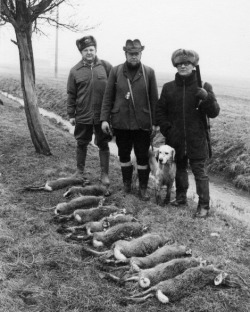 Erich Honecker poses with kills from the State Hare Hunt