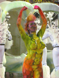 Topless and body painted at a Brazilian carnival, by Sergio seLusava Carioca Copacabana.