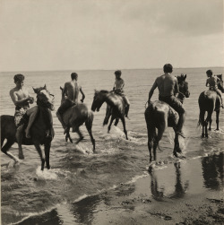 natgeofound:  Men on horseback run through the surf in Tahiti, 1922. Photograph by Edward Burton MacDowell, National Geographic Creative