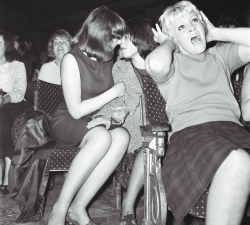 classiclesbians:Lesbian Couple of the Day: Spectators at a Beatles concert in Wigan, Greater Manchester, England in 1964.