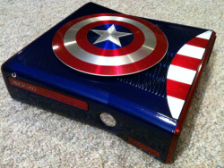 otlgaming:  PATRIOTIC CAPTAIN AMERICA XBOX 360 S MOD Zachariah Cruse recently finished this mod for an Xbox 360 slim model themed after Marvel Comics superhero Captain America.  It’s a beautiful job but I would wonder if Cap’s shield comes off in