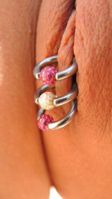 pussymodsgaloreShe has pierced inner labia with three decorative rings sealing them shut. Chastity piercing.
