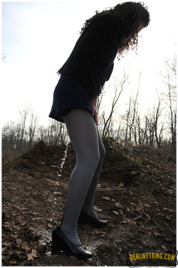 realwetting:  Sara was walking in the forest but she took another road for returning to the car. Needing already to pee and with that trench in her way, she releases her bladder in her pantyhose.