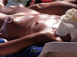beach voyeur: hard nipples on oily tits