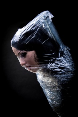 darkangelsbride:  Photo by Alexander Horn  Is this art or just a damsel wrapped in plastic? Bondage and fetish images @  Art of Bondage