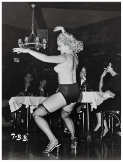 Rita Grable shakes things up, during a performance at an unidentified 50’s-era nightclub..