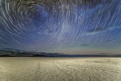 americasgreatoutdoors:  Star trails above the Bonneville Salt Flats in Utah almost look like a tunnel into hyperspace. These salt flats are made of approximately 90 percent common table salt, weighing millions of tons. The crust is up to 5 feet thick