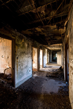  Ward corridor in Building 17, Norristown State Hospital.  The longest-abandoned building still standing on this asylum campus, Building 17 was used by firefighters as a burn test building; they’d light up a portion of it and then put out the fire.
