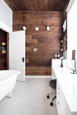 Sacred Oasis Modern minimal wash room with a classic claw foot tub, and a beautiful accent wall made of reclaimed wood.