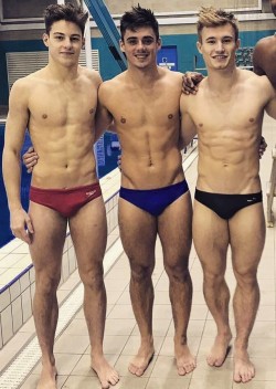 sfswimfan-original: sfswimfan:  From a Insta post around 1/23 by British diver Jack Laugher (black suit) we have him looking stunning with his teammates Chris Mears (blue suit) and Anthony Hard , err, I mean Harding, (red suit with 2:30 bulge!) Jack’s