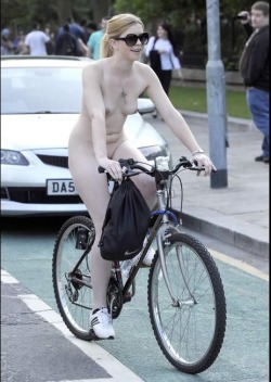 reallifenudism:  Becky. Becky is a 23-year-old nudist from England.  These photos were taken of her when she took part in the World Naked Bike Ride in Manchester in 2012.  Some of them were even published in a tabloid newspaper. Becky loves to be a