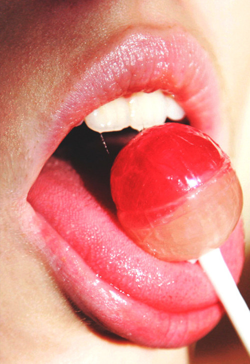 Girl masturbates with lollipop