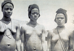 ukpuru:  Preparing for Marriage Girls with recently cut Mbubu marks Among the Ibos of Nigeria [Public Domain], G. T. Basden, early 20th century. 