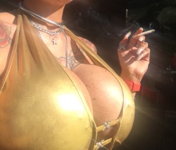 fnchen:  *bling* Nothing better than enjoying the sun and a cigarette in a golden shirt, making sure every single person in the vicinity pays attention to my huge boobs   More kinky pics at http://www.patreon.com/katiedoll