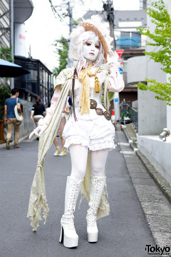 tokyo-fashion:  Shironuri artist Minori on the street in Harajuku w/ corset top, flower-&amp;-lace covered straw hat, vintage/remake fashion &amp; platform boots. Our previous video interview with Minori is here. 
