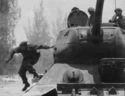 historicaltimes:  Fidel Castro leaps of a tank during the Bay of Pigs Invasion - April 17, 1961 